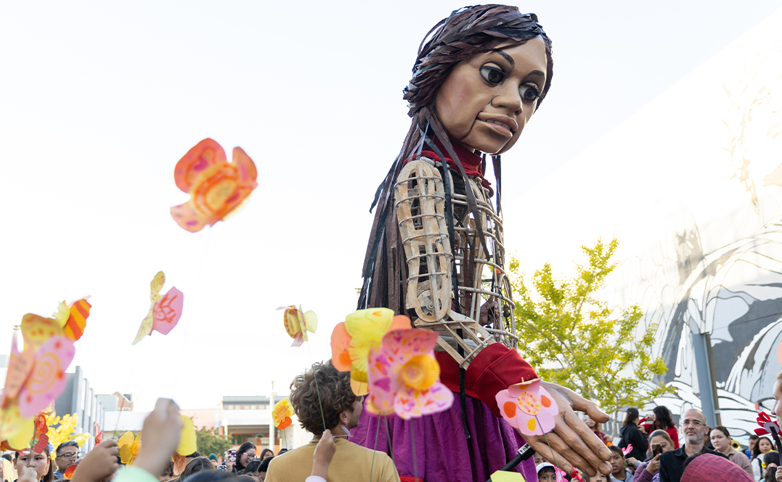 Photo from 'Walk with Amal,' an event featuring a 12ft puppet of a 10 year old Syrian refugee 