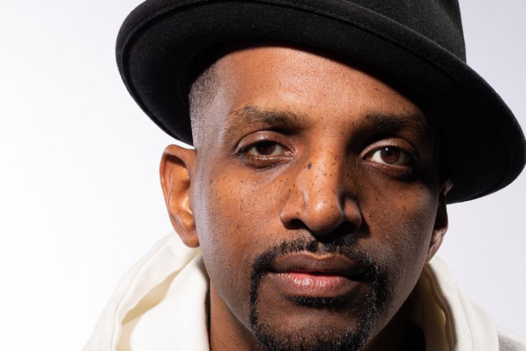 Headshot image of J.Ivy