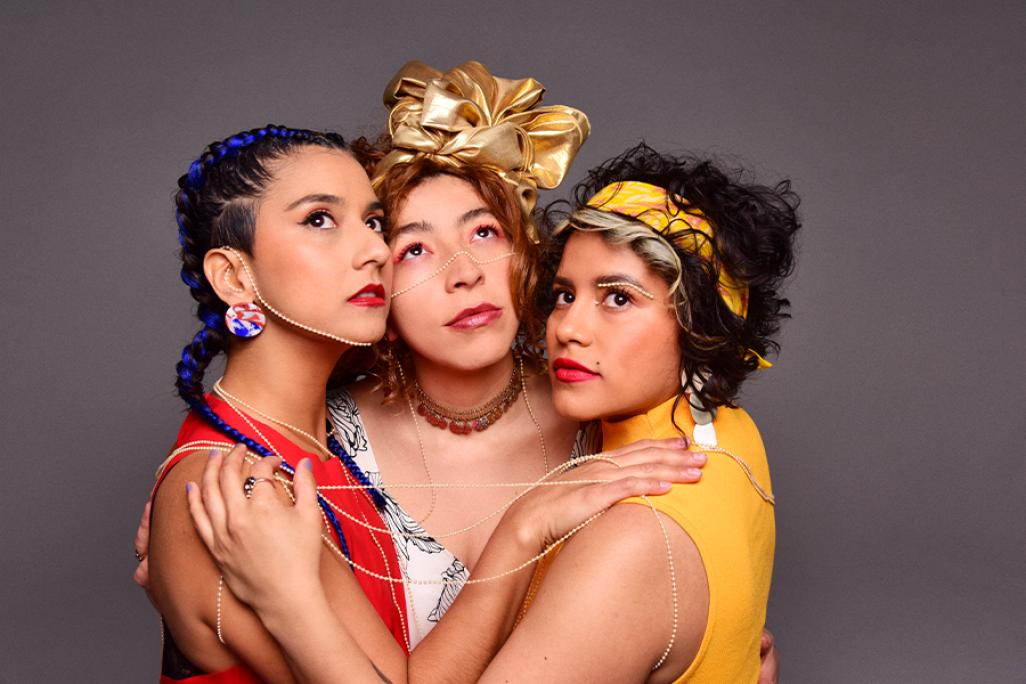 Members of LADAMA pose together hugging