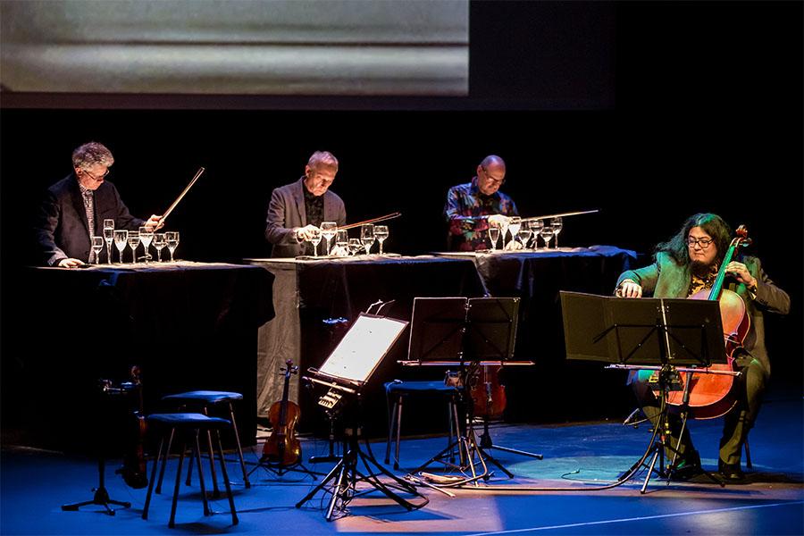 Kronos Quartet performing on stage