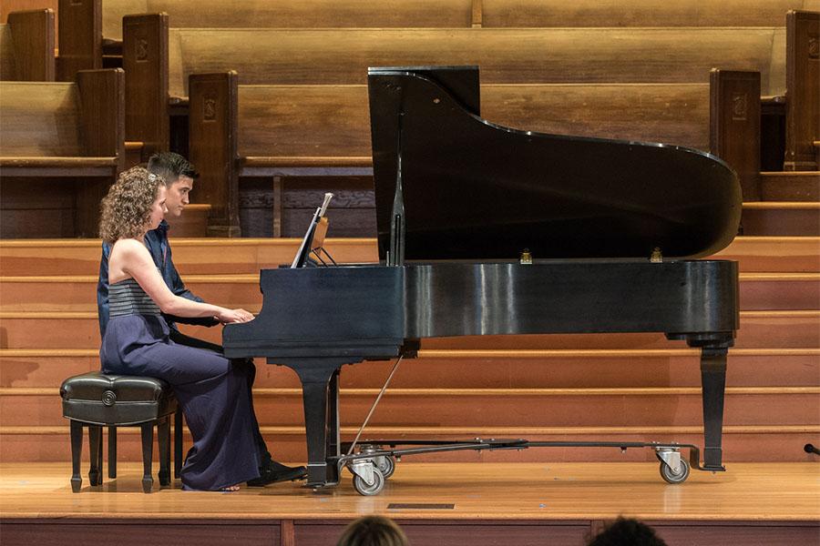 Sarah Gibson and Thomas Kotcheff sitting at the piano