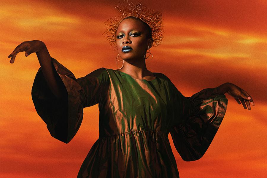 Image of Cécile McLorin Salvant posed in front of a backdrop of an orange sky 