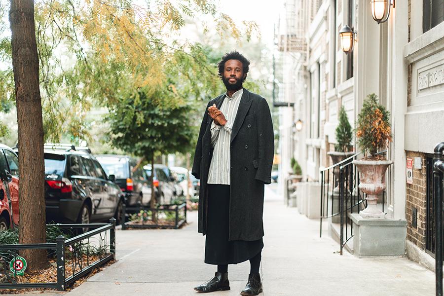 JJJJJerome Ellis poses standing in the middle of a city sidewalk